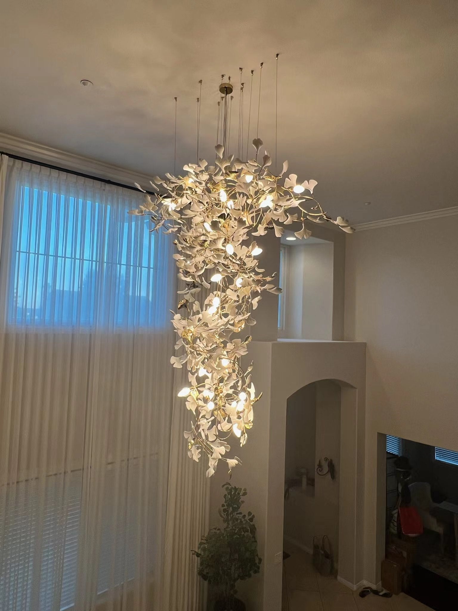 Artistic Tree Branch Pendant Light with Ceramic Ginkgo Leaves for High Ceilings in Hotel or Home - Luster Gaze