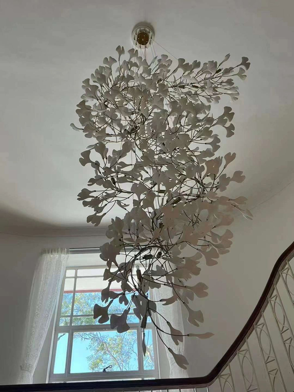 Artistic Tree Branch Pendant Light with Ceramic Ginkgo Leaves for High Ceilings in Hotel or Home