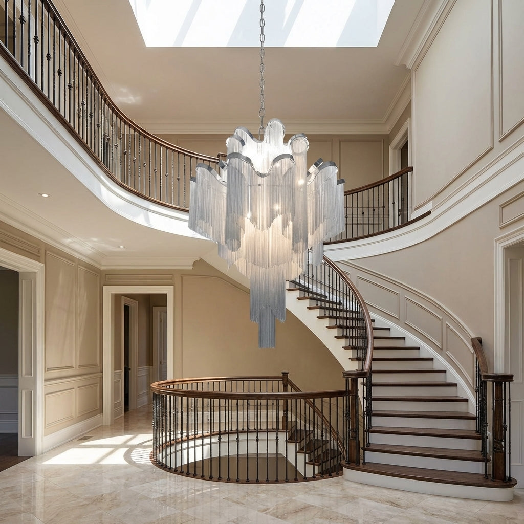 Luster Gaze Grand Cascade Extra Large Stainless Steel Long Tassel Chandelier - dramatic American stairwell with soaring ceiling
