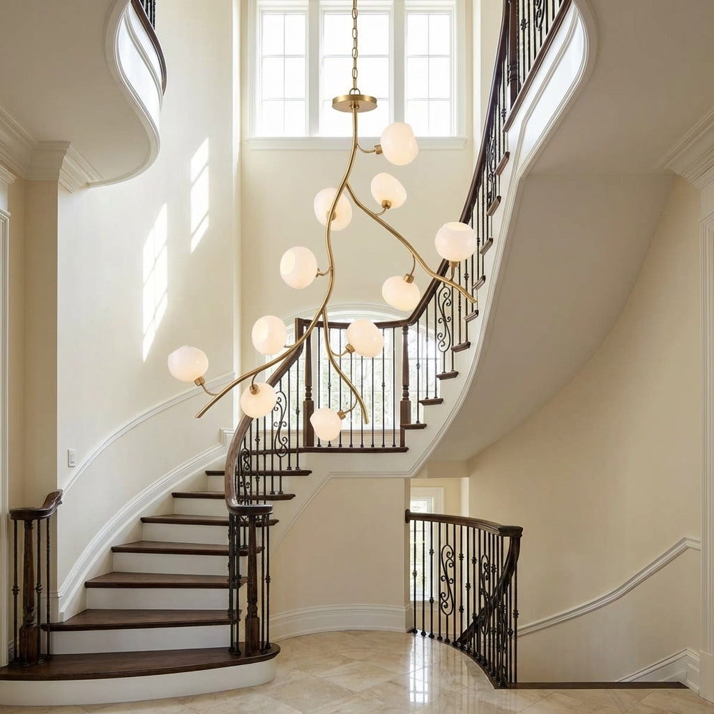Luster Gaze Veridian Branch Brass Chandelier with Artisan Glass - dramatic American stairwell with soaring ceiling