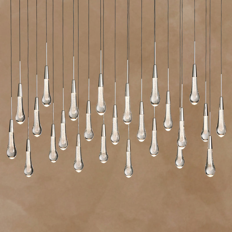 Chandelier with multiple hanging lampshades on a brown background
